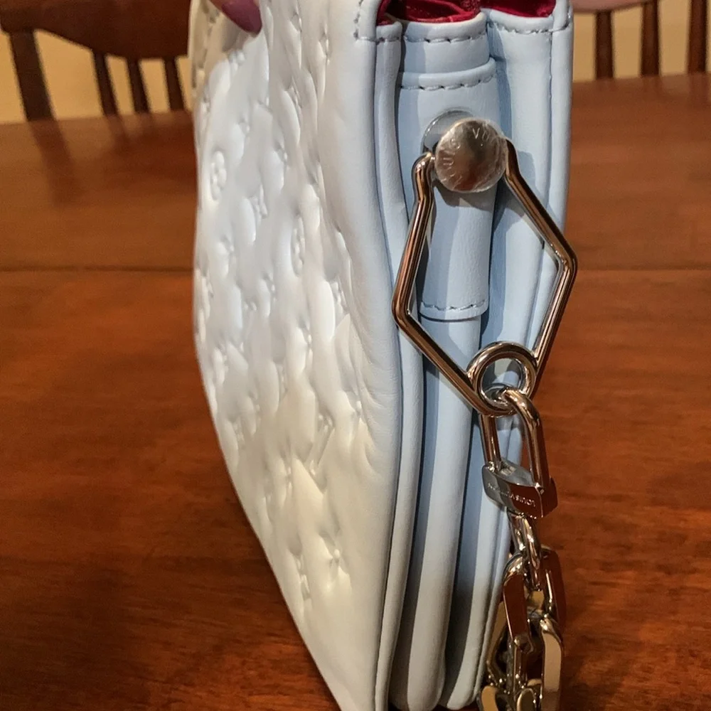 Authentic Brand new Louis Vuitton baby blue color Embossed Leather Chain purse.